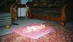 Jacob sleeps on his quilt in the living room