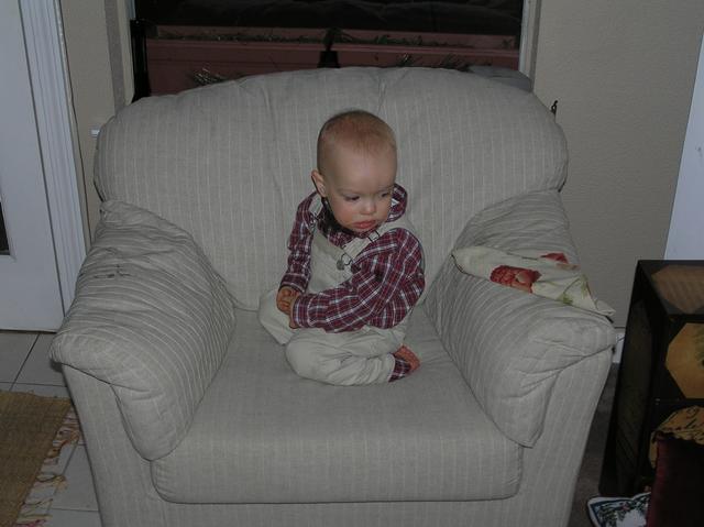 Jacob enjoys bouncing on Greg's chair