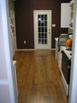 Our new kitchen laminate wood floor, installed by Erik with help from his friend John Jeffords