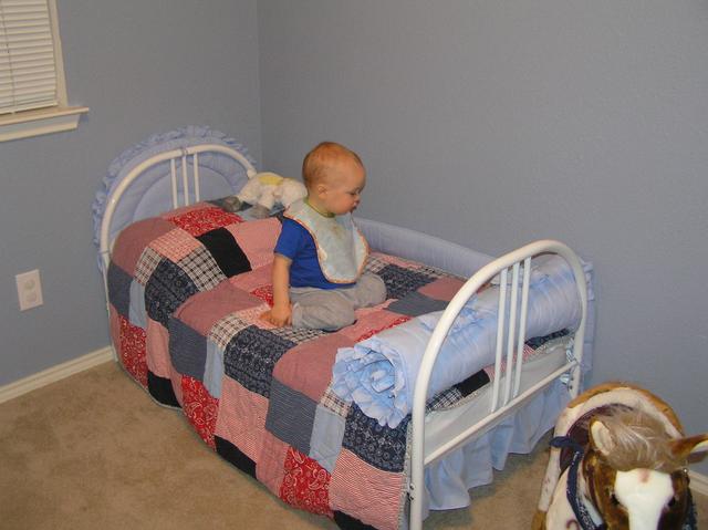 Jacob enjoys the toddler bed in his room