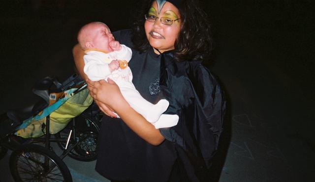 Jacob's cousin Samantha holds him before heading out for Hallowe'en