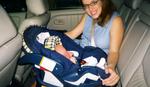 Kathy double–checks Erik’s car seat installation job for the first car ride back to Fort Worth