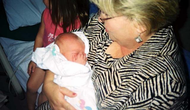 Grandma Morris holds grandchild number eight