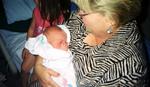 Grandma Morris holds grandchild number eight