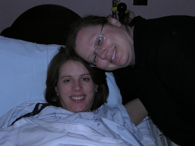 By 1 p.m., Kathy has had an IV addition of pitocin to speed up labor, and an epidural to keep her happy, as evidenced by this smiling shot of her and sister Sherrie.