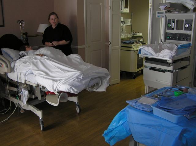 It's 3:30, and Lacy is almost ready to be born. Sherrie says a few last words of encouragement as the nurses prepare everything.