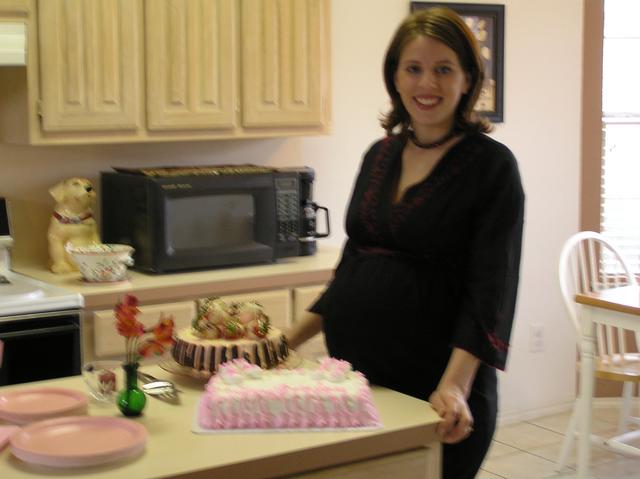 Kathy poses with her two beautiful cakes