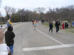 Kathy runs by the 12 mile mark at White Rock Lake