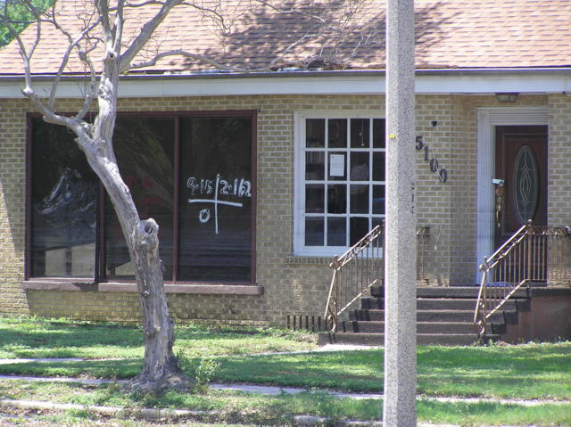 Local home with search and rescue markings still visible