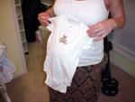 Kathy at 35 weeks, showing off some clothing stitched with love by Aunt Sarah