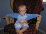 Jacob enjoys the rocking chair that Mommy recovered for him